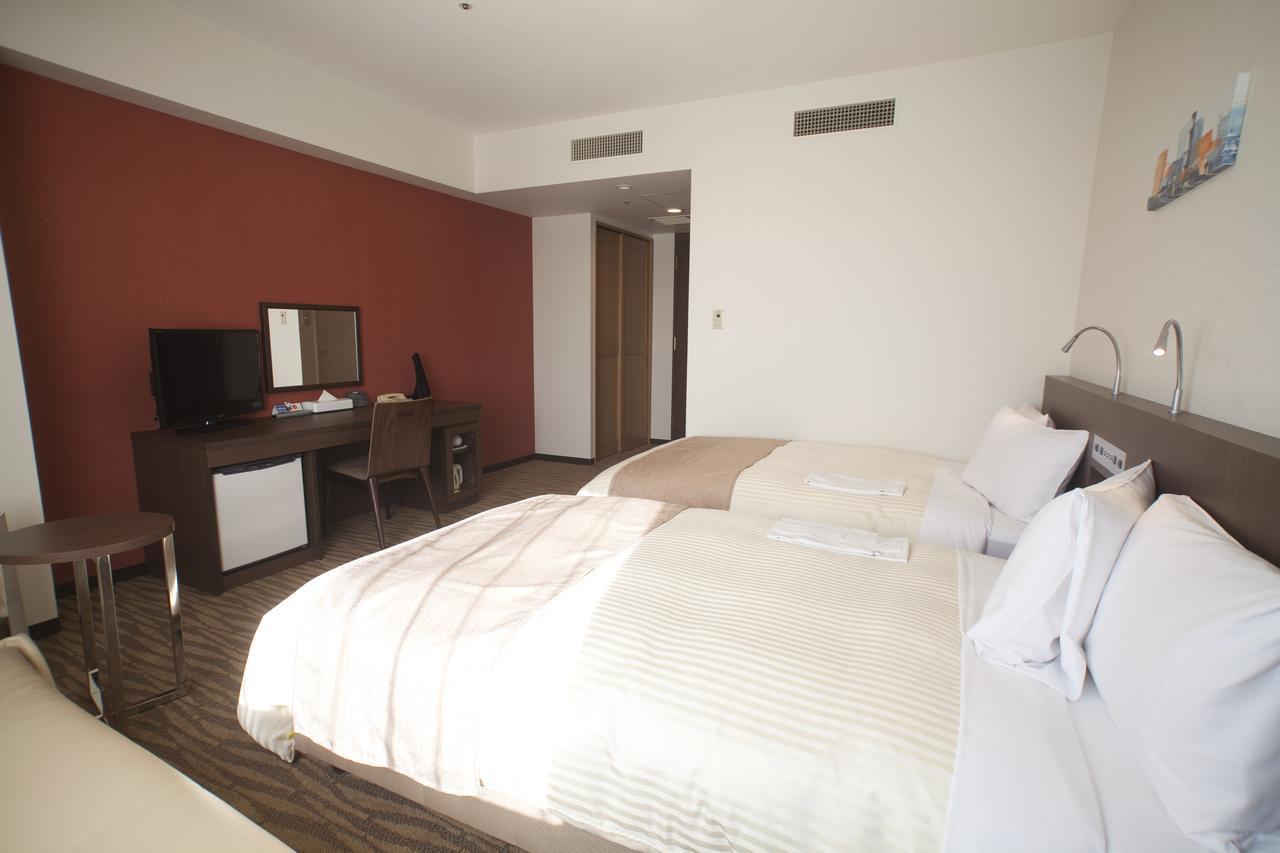 Hotel Port Plaza Тиба Экстерьер фото A room at the hotel