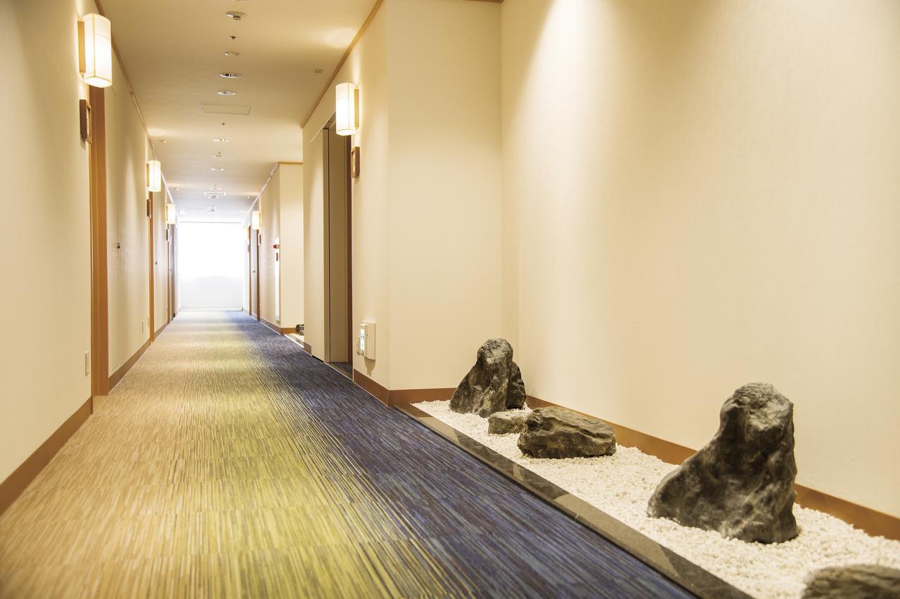 Hotel Port Plaza Тиба Экстерьер фото A corridor in a hotel