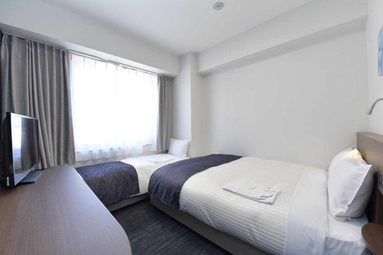 Hotel Port Plaza Тиба Экстерьер фото A room at the hotel