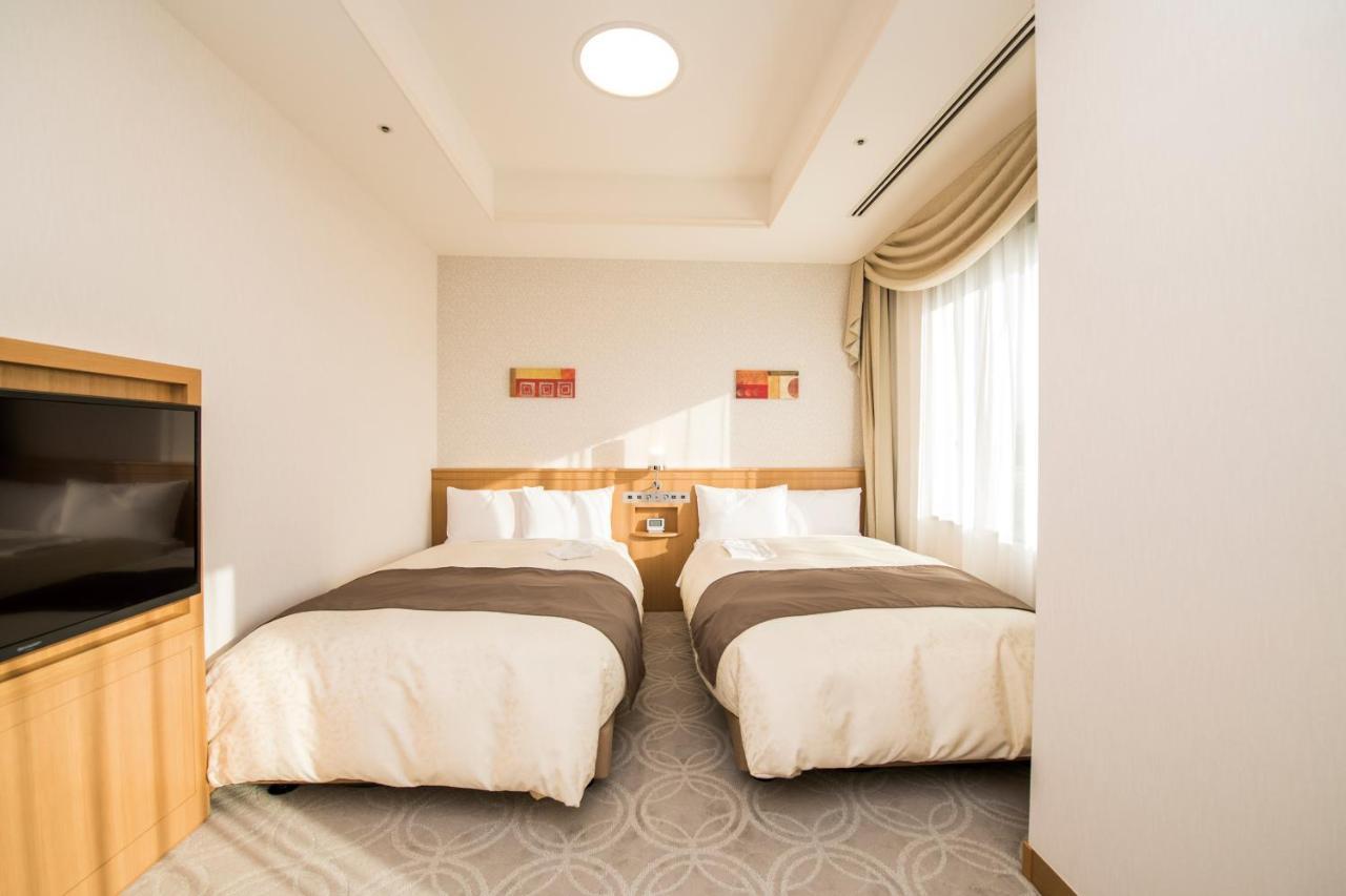 Hotel Port Plaza Тиба Экстерьер фото A room at the hotel